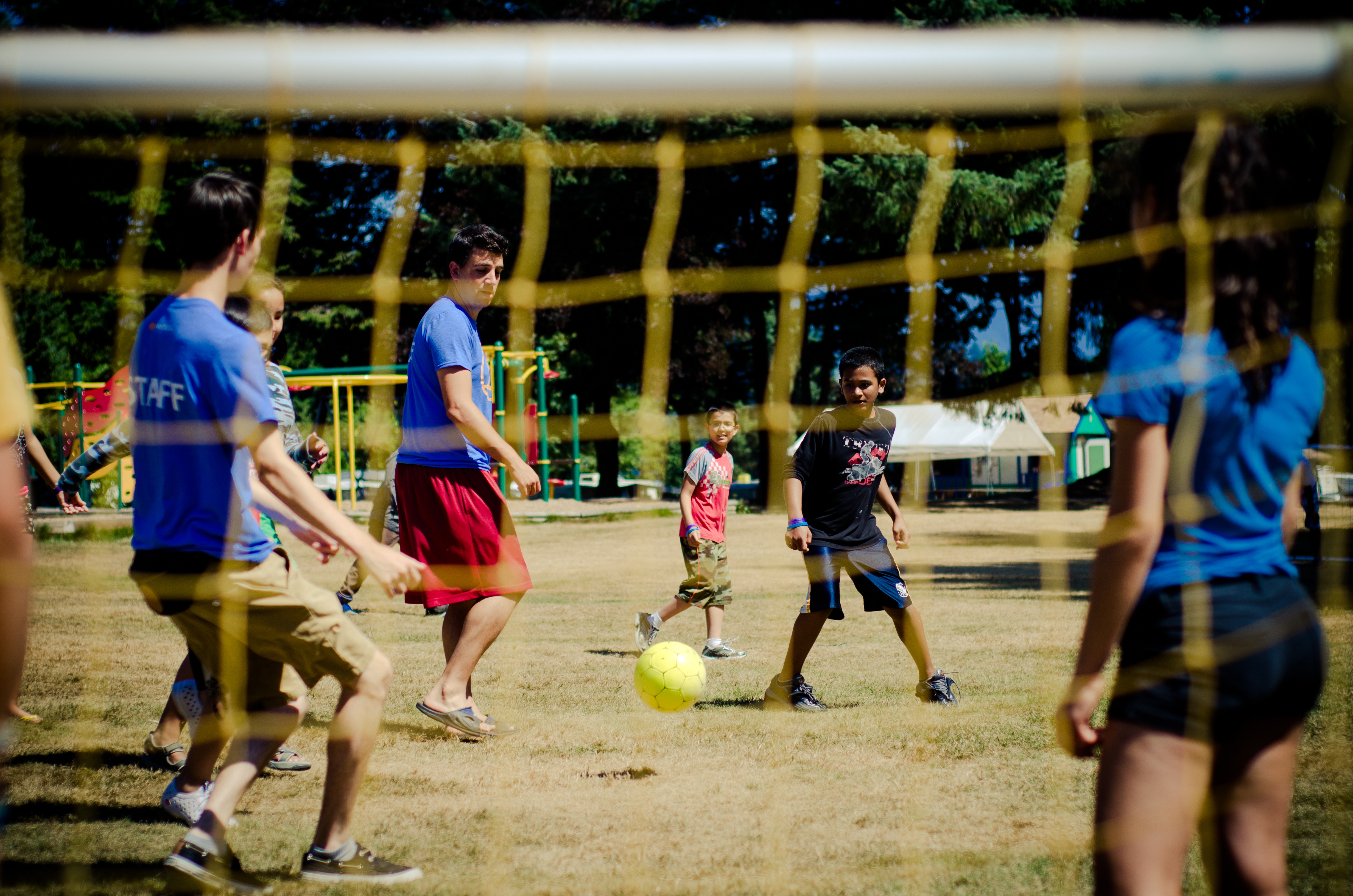 Kids playing soccer at summer camp